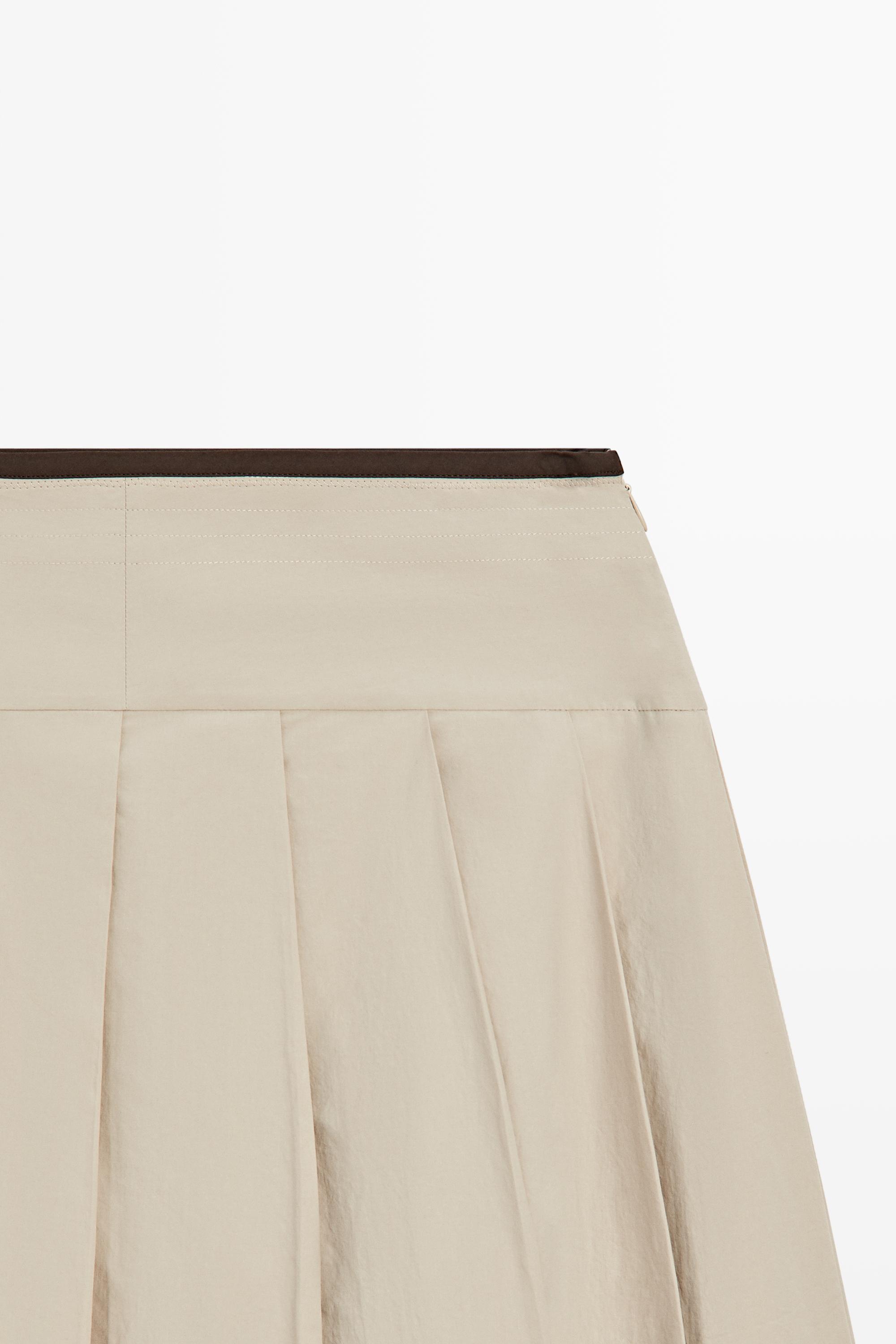 Pleated midi skirt with contrasting sash